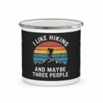 White enamel hiking mug with retro sunset and funny “I Like Hiking and Maybe Three People” quote design